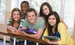 Group of college students leaning on banister