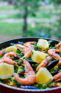 Close up classic seafood paella with mussels, shrimps and vegeta
